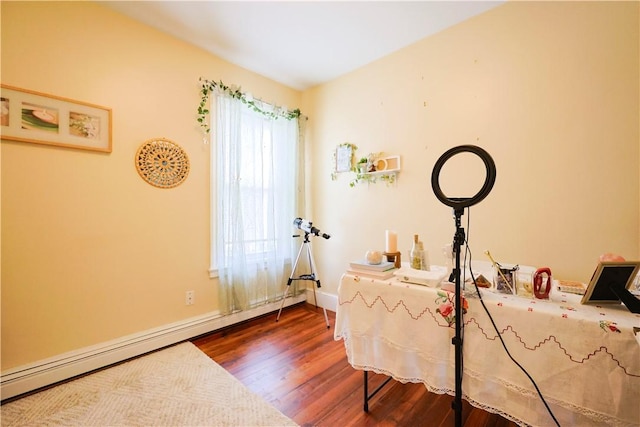 10 Walnut St, East Providence, RI 02914 - office area featuring a baseboard radiator and wood finished floors