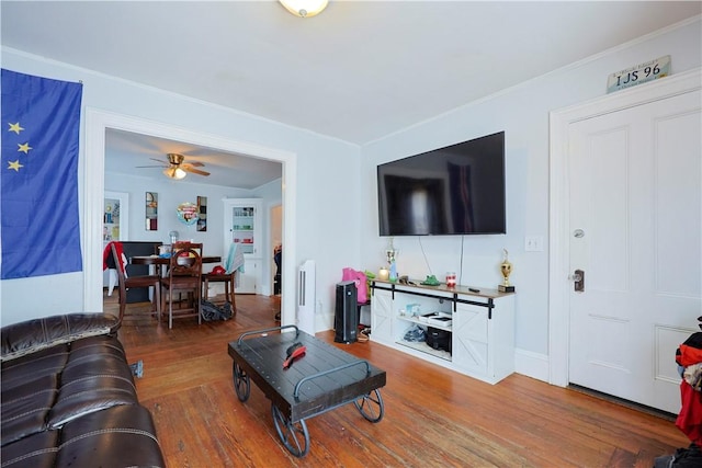 10 Walnut St, East Providence, RI 02914 - living area with wood finished floors, ceiling fan, and crown molding