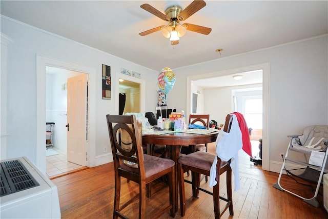 10 Walnut St, East Providence, RI 02914 - dining room with light wood-style flooring, a ceiling fan, and ornamental molding