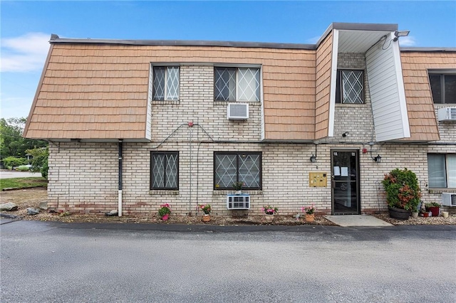 132 Hoffman Ave Unit 116, Cranston, RI 02920 - view of front of house featuring brick siding and mansard roof