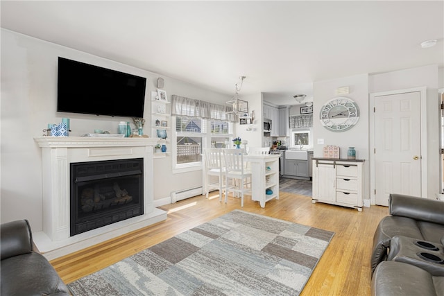 13 Vaughan Ave, Newport, RI 02840 - living room featuring light wood-style flooring and a fireplace