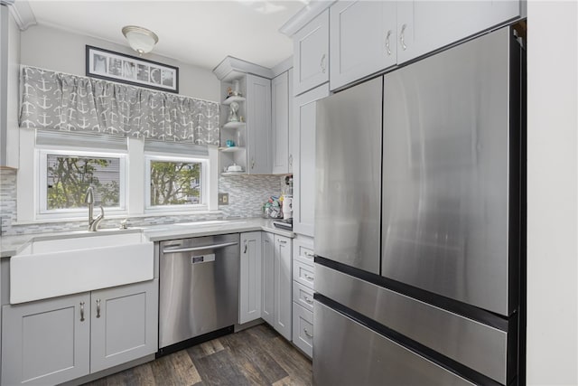 13 Vaughan Ave, Newport, RI 02840 - kitchen with stainless steel appliances, light countertops, decorative backsplash, and dark wood-style floors