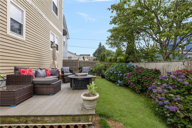 13 Vaughan Ave, Newport, RI 02840 - fenced backyard featuring a deck and an outdoor living space with a fire pit