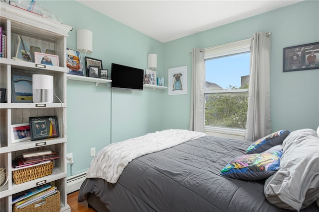 13 Vaughan Ave, Newport, RI 02840 - bedroom with a baseboard heating unit and wood finished floors