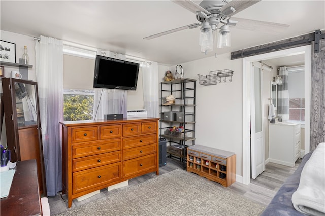 13 Vaughan Ave, Newport, RI 02840 - living room featuring ceiling fan, light wood-style flooring, and a barn door