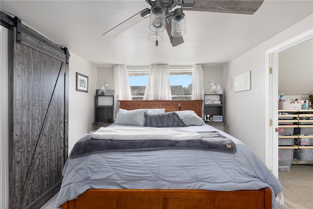 13 Vaughan Ave, Newport, RI 02840 - bedroom with a barn door, carpet floors, and a ceiling fan