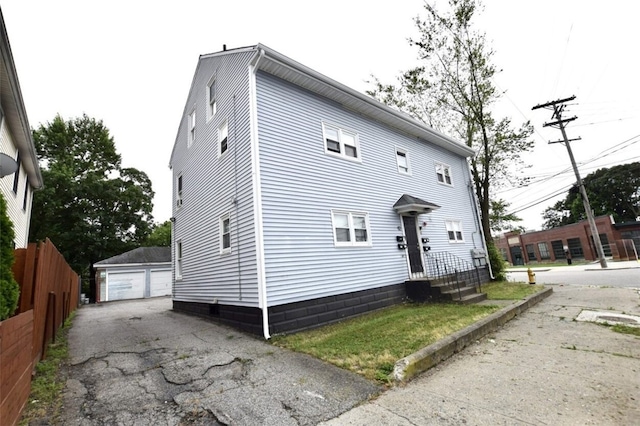 92 Jefferson St, Pawtucket, RI 02860 - view of front facade with a detached garage and an outbuilding
