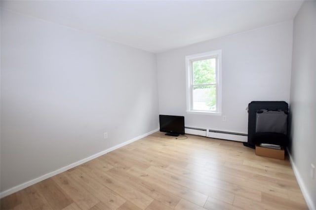 92 Jefferson St, Pawtucket, RI 02860 - empty room with baseboard heating and light wood-style floors