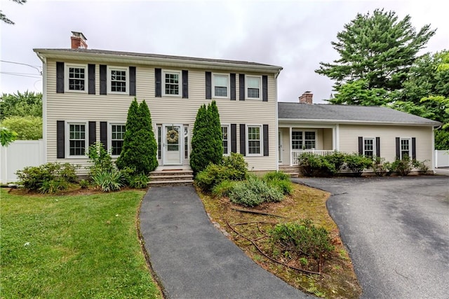 11 Greenbrier Rd, Smithfield, RI 02828 - colonial home with a chimney and driveway