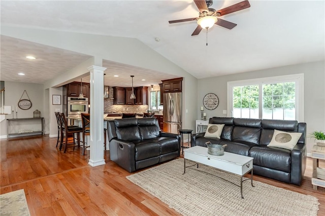 11 Greenbrier Rd, Smithfield, RI 02828 - living room with a ceiling fan, lofted ceiling, light wood finished floors, recessed lighting, and decorative columns