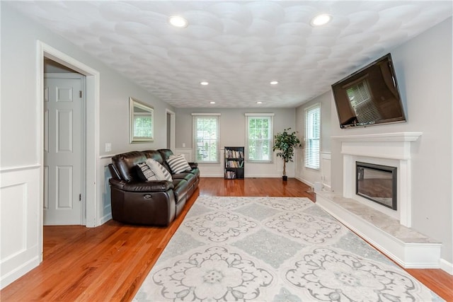 11 Greenbrier Rd, Smithfield, RI 02828 - living area with light wood finished floors, recessed lighting, and a high end fireplace