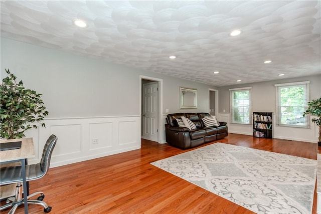 11 Greenbrier Rd, Smithfield, RI 02828 - living area with recessed lighting, wainscoting, and wood finished floors