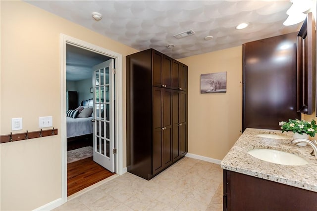 11 Greenbrier Rd, Smithfield, RI 02828 - bathroom featuring double vanity and ensuite bathroom