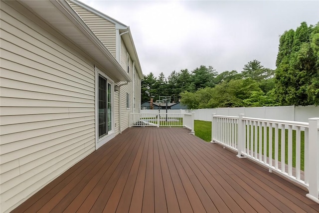 11 Greenbrier Rd, Smithfield, RI 02828 - deck with a fenced backyard and view of wooded area