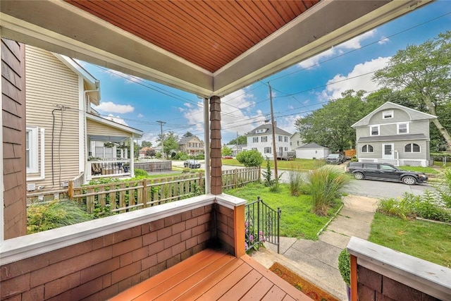 37 Denver Ave, Cranston, RI 02905 - wooden porch featuring a residential view
