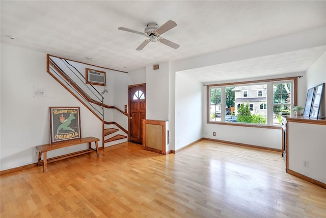 37 Denver Ave, Cranston, RI 02905 - foyer entrance with light wood-type flooring, a wall mounted air conditioner, stairway, and ceiling fan