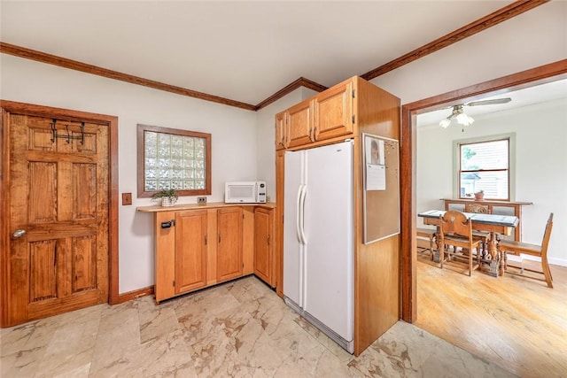 37 Denver Ave, Cranston, RI 02905 - kitchen with white appliances, crown molding, light countertops, ceiling fan, and light marble finish floors