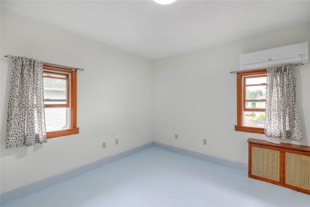 37 Denver Ave, Cranston, RI 02905 - unfurnished room with a wall unit AC and concrete floors