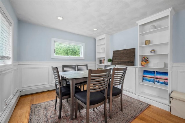 5 Harding St, Coventry, RI 02816 - dining room featuring a wainscoted wall, light wood-type flooring, recessed lighting, and a decorative wall