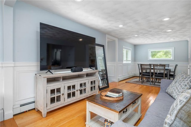5 Harding St, Coventry, RI 02816 - living room with a wainscoted wall, a decorative wall, light wood-style flooring, recessed lighting, and a baseboard radiator
