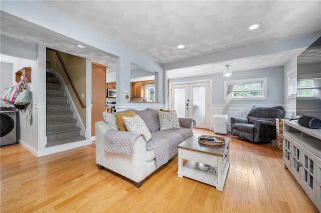 5 Harding St, Coventry, RI 02816 - living area featuring washer / clothes dryer, stairs, light wood finished floors, wainscoting, and recessed lighting