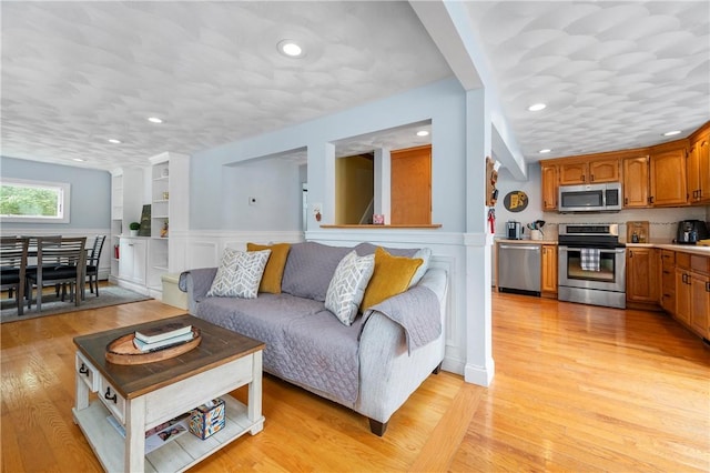 5 Harding St, Coventry, RI 02816 - living room featuring wainscoting, light wood-type flooring, and recessed lighting