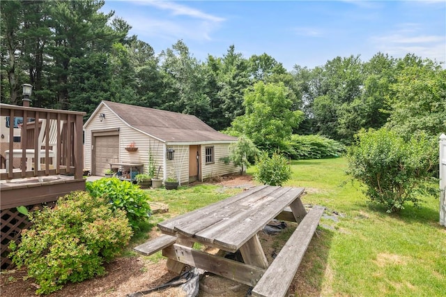 5 Harding St, Coventry, RI 02816 - view of grassy yard featuring an outdoor structure, a wooden deck, and a garage