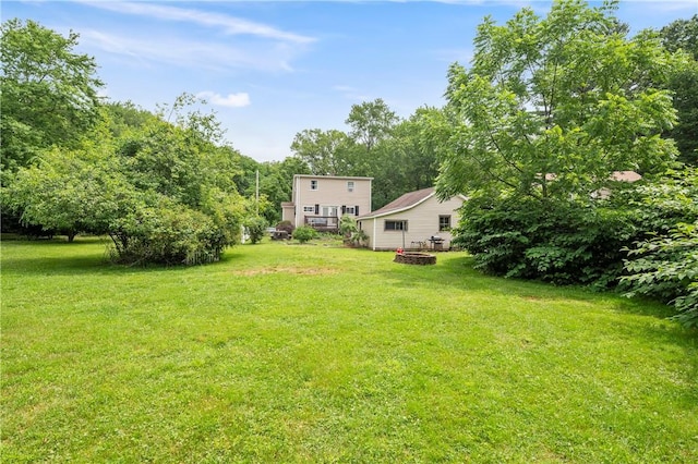 5 Harding St, Coventry, RI 02816 - view of green lawn featuring a fire pit