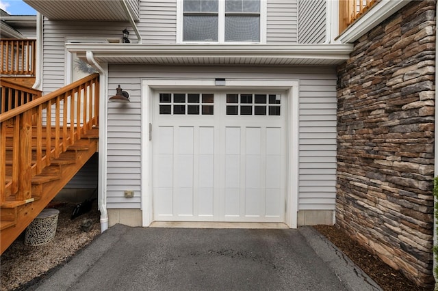 5 Jupiter Ln Unit F, Richmond, RI 02898 - garage featuring asphalt driveway