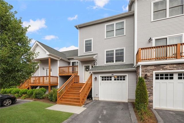 5 Jupiter Ln Unit F, Richmond, RI 02898 - view of front of home with a garage, driveway, stairs, and stone siding