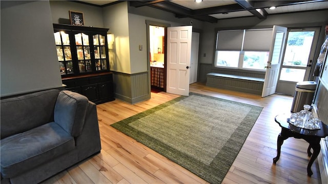151 Hadde Ave, Cumberland, RI 02864 - living room with coffered ceiling, light wood finished floors, beamed ceiling, and a wainscoted wall