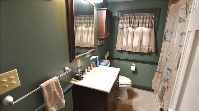 151 Hadde Ave, Cumberland, RI 02864 - bathroom featuring a wainscoted wall, vanity, tile patterned flooring, and a shower with shower curtain