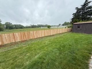 446 Angell Rd, North Providence, RI 02904 - fenced backyard featuring a storage shed