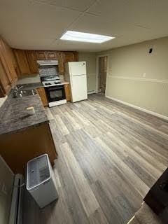 446 Angell Rd, North Providence, RI 02904 - kitchen with freestanding refrigerator, black range, under cabinet range hood, light wood-style flooring, and brown cabinetry