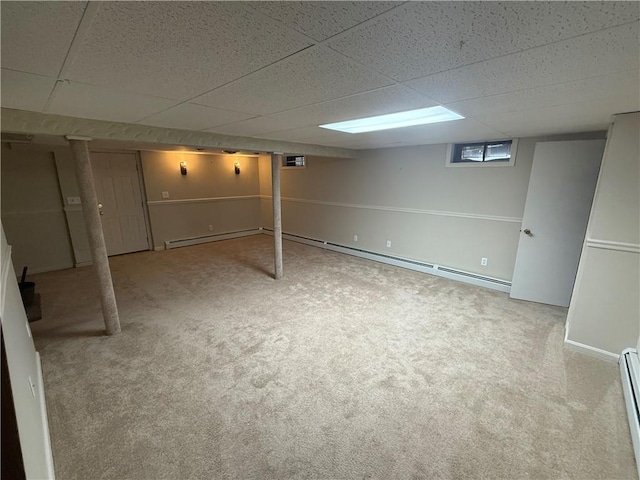446 Angell Rd, North Providence, RI 02904 - below grade area featuring carpet floors, baseboard heating, and a drop ceiling