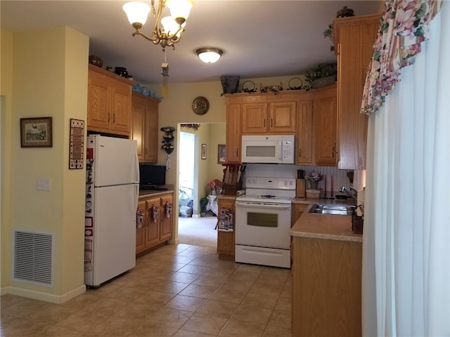 170 Providence Pike Unit 52, North Smithfield, RI 02896 - kitchen featuring white appliances, light tile patterned flooring, a chandelier, and light countertops