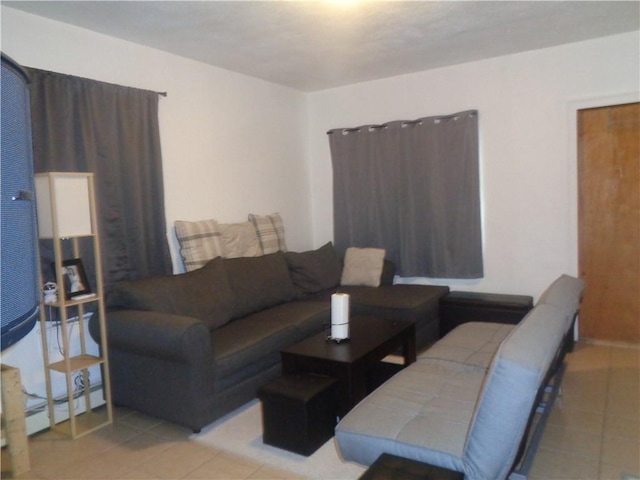 269 Althea St, Providence, RI 02907 - tiled living area with a baseboard heating unit