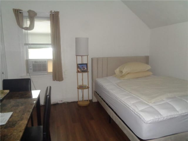 269 Althea St, Providence, RI 02907 - bedroom with dark wood-style floors, lofted ceiling, and cooling unit