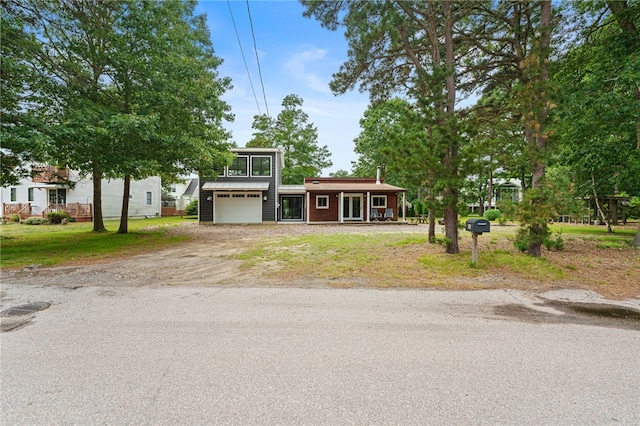 40 Alder Rd, Charlestown, RI 02813 - view of front of house with driveway and an attached garage