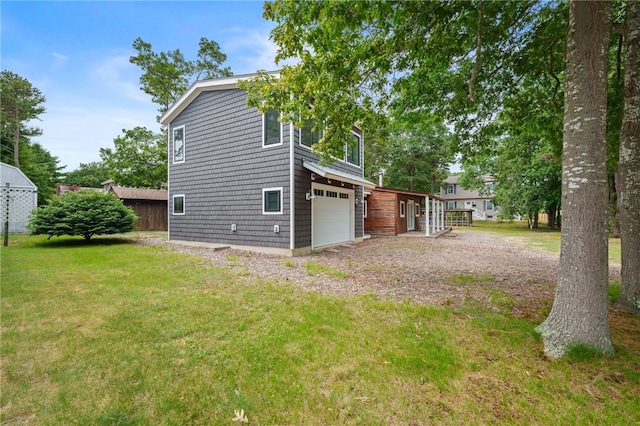 40 Alder Rd, Charlestown, RI 02813 - view of side of home with a lawn, a garage, and driveway