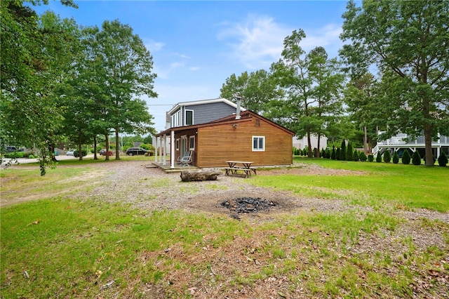 40 Alder Rd, Charlestown, RI 02813 - view of side of home with a yard