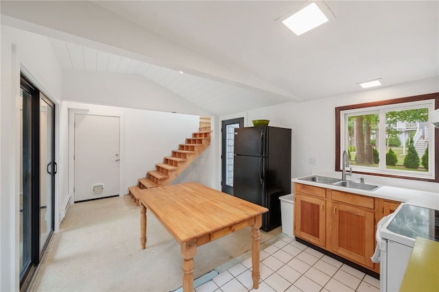 40 Alder Rd, Charlestown, RI 02813 - kitchen with freestanding refrigerator, lofted ceiling, white electric range, light countertops, and brown cabinets