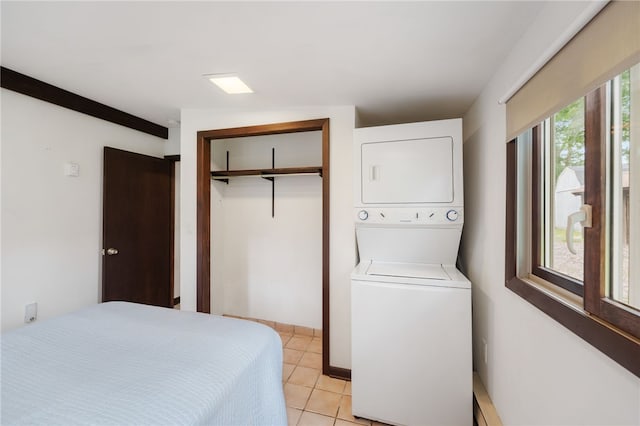 40 Alder Rd, Charlestown, RI 02813 - bedroom with stacked washer and clothes dryer, a closet, and light tile patterned floors