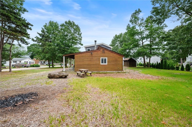 40 Alder Rd, Charlestown, RI 02813 - view of side of property featuring a lawn