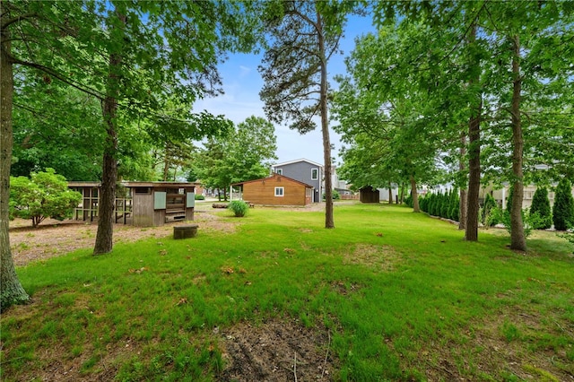 40 Alder Rd, Charlestown, RI 02813 - view of green lawn featuring an outdoor structure and exterior structure