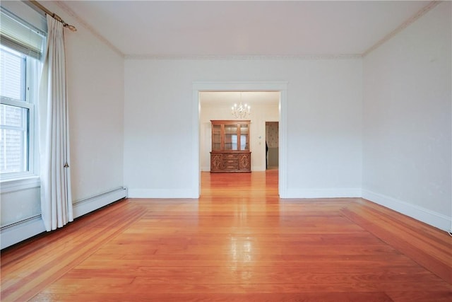 162 Rand St, Central Falls, RI 02863 - spare room with a chandelier, light wood-style floors, and ornamental molding