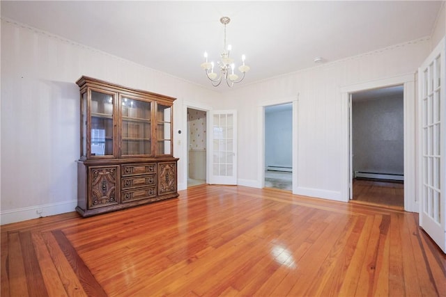 162 Rand St, Central Falls, RI 02863 - unfurnished dining area featuring baseboard heating, a chandelier, a baseboard radiator, and light wood-style floors