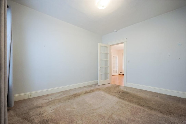 162 Rand St, Central Falls, RI 02863 - carpeted spare room with baseboards and a baseboard heating unit