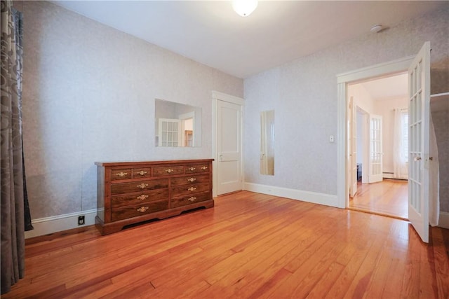 162 Rand St, Central Falls, RI 02863 - unfurnished bedroom with hardwood / wood-style flooring and baseboards