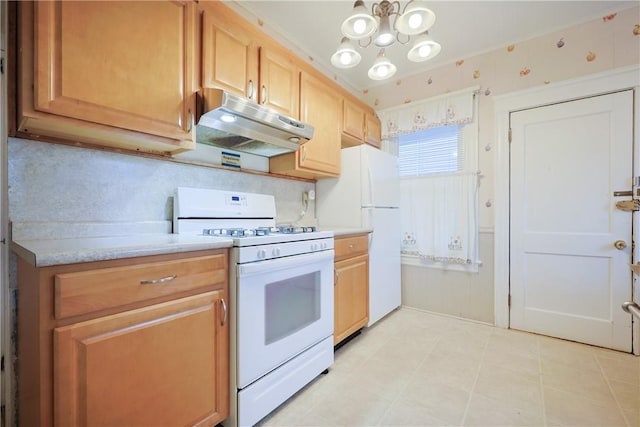 162 Rand St, Central Falls, RI 02863 - kitchen with white appliances, under cabinet range hood, light countertops, a chandelier, and light brown cabinetry